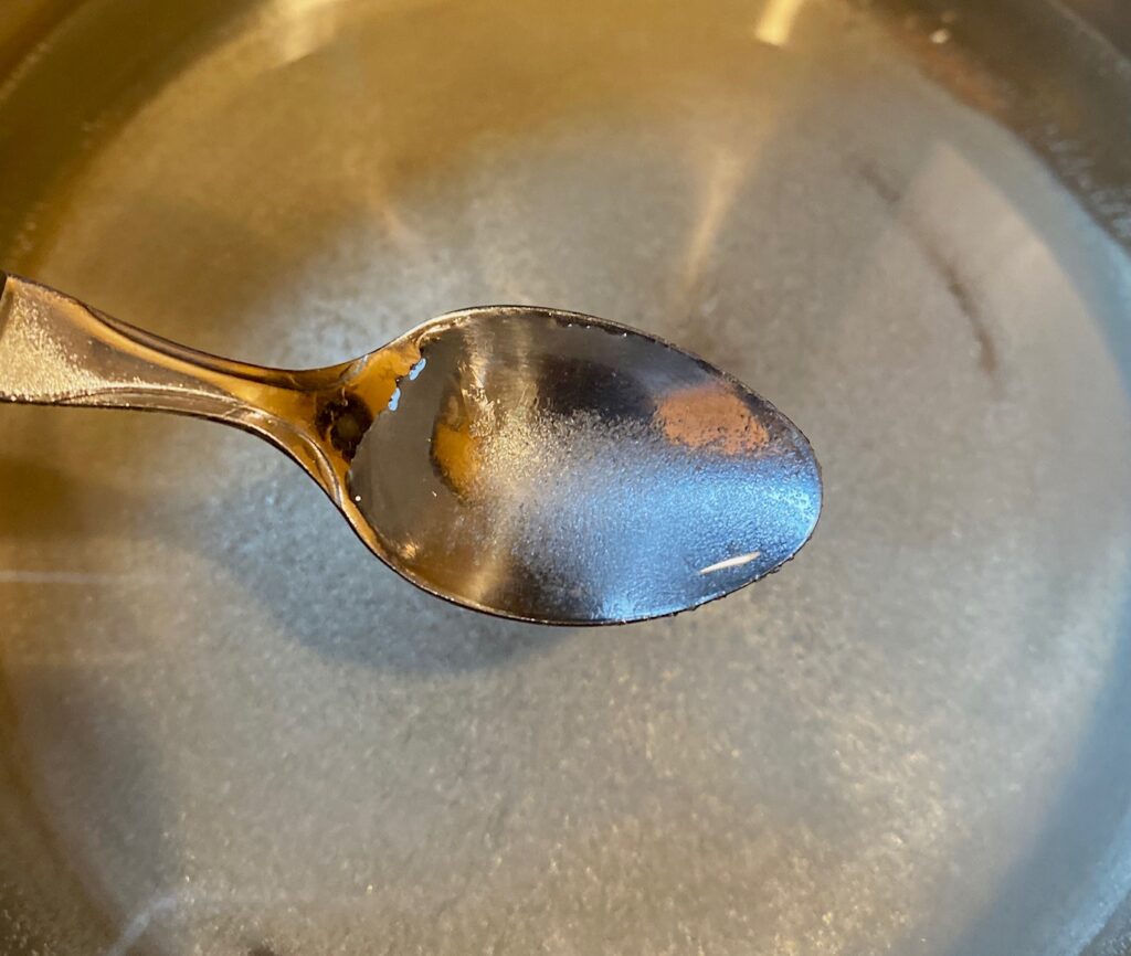 granualted sugar on a spoon