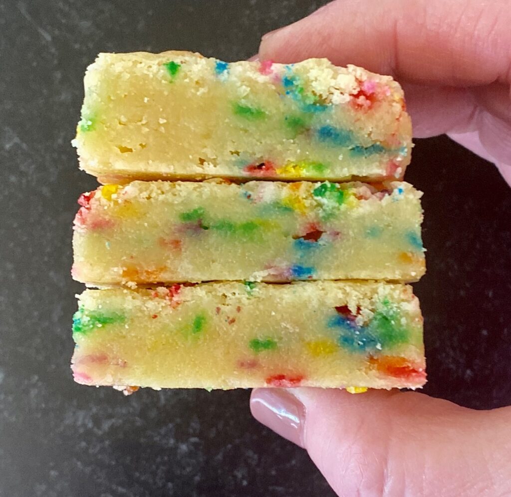 hand holding 3 sugar cookie bars