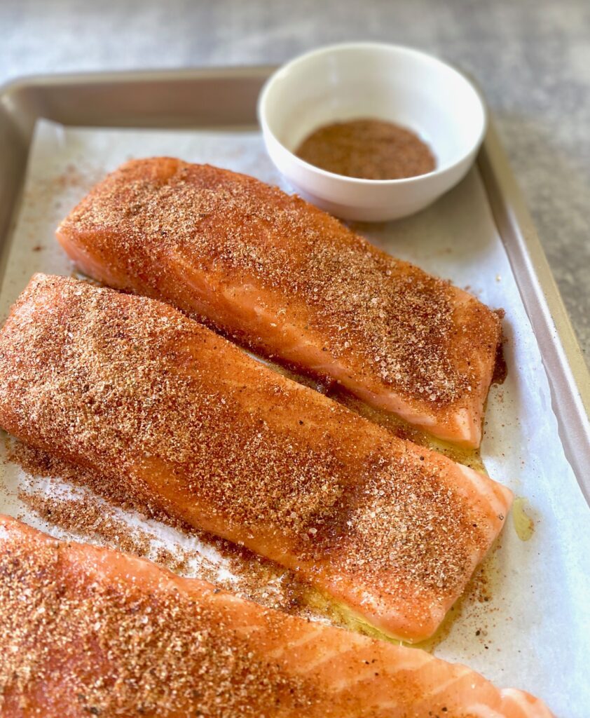 tray of seasoned salmon filets