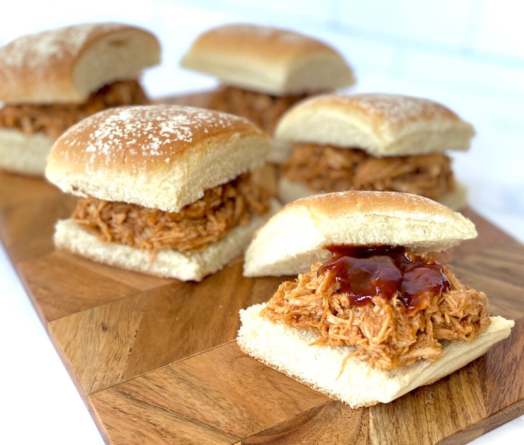 BBQ chicken sliders on a board