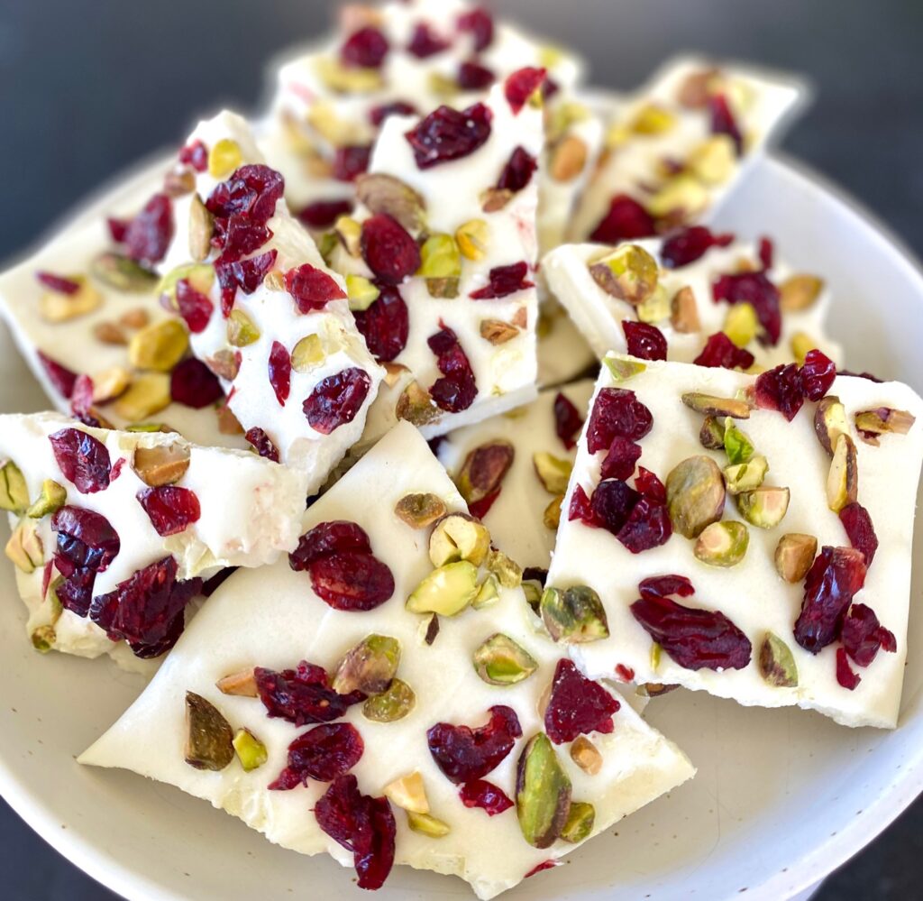 plate of vanilla bark with cranberries and pistachios