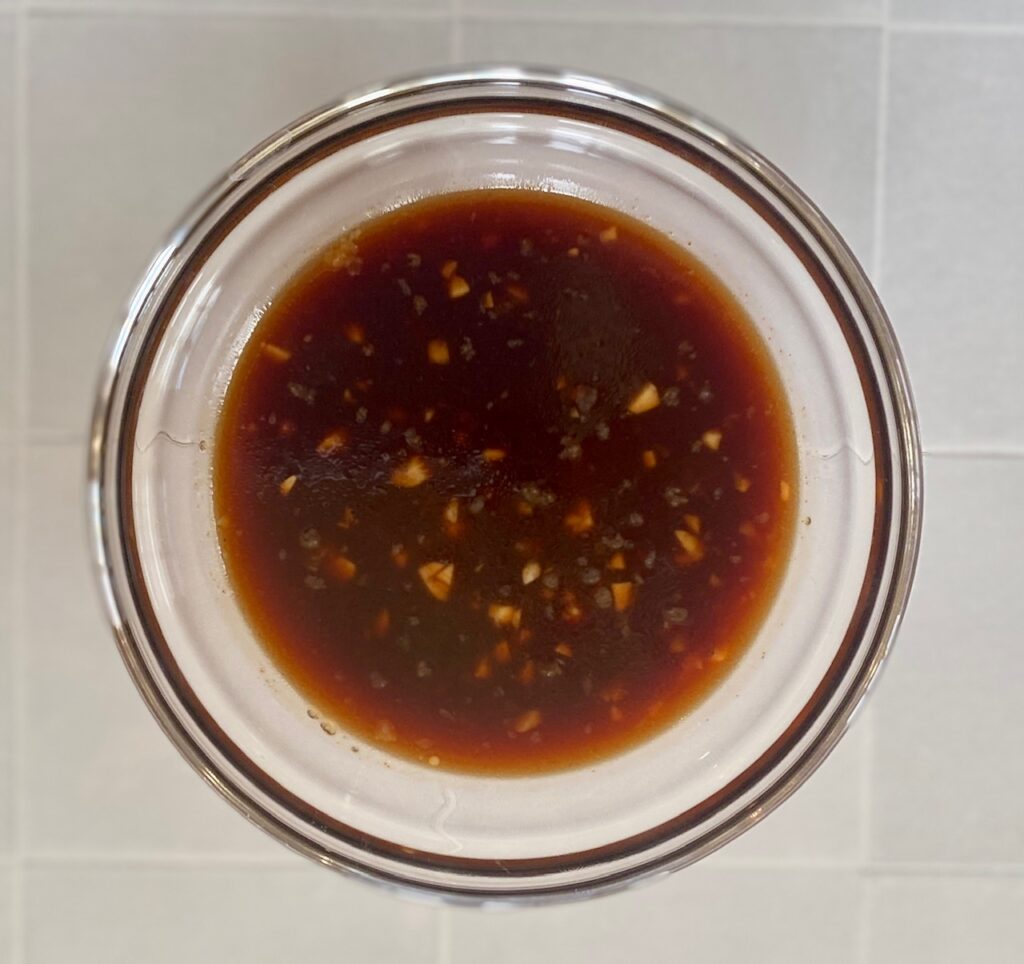 a glass bowl of chinese sauce