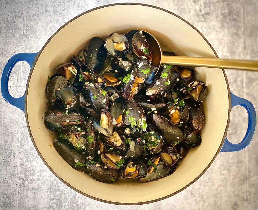 dutch oven with garlicky shellfish