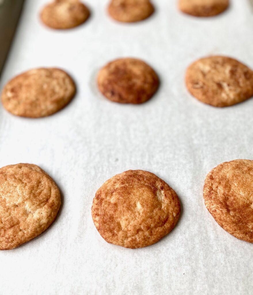 baked snickerdoodle cookies on tray