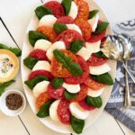 caprese salad with spoon and napkin