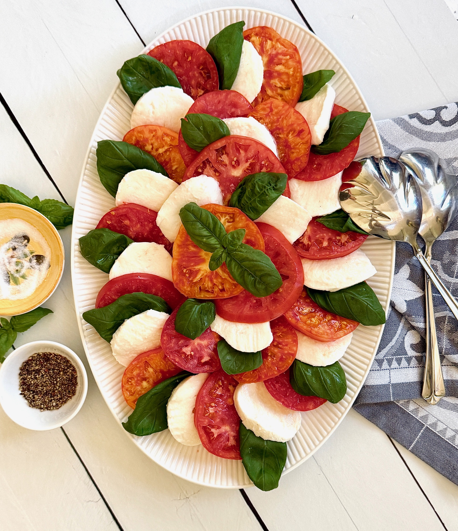 caprese salad with spoon and napkin
