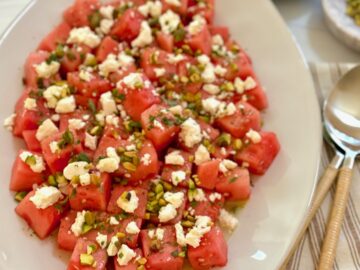 a platter of watermelon feta salad with spoon