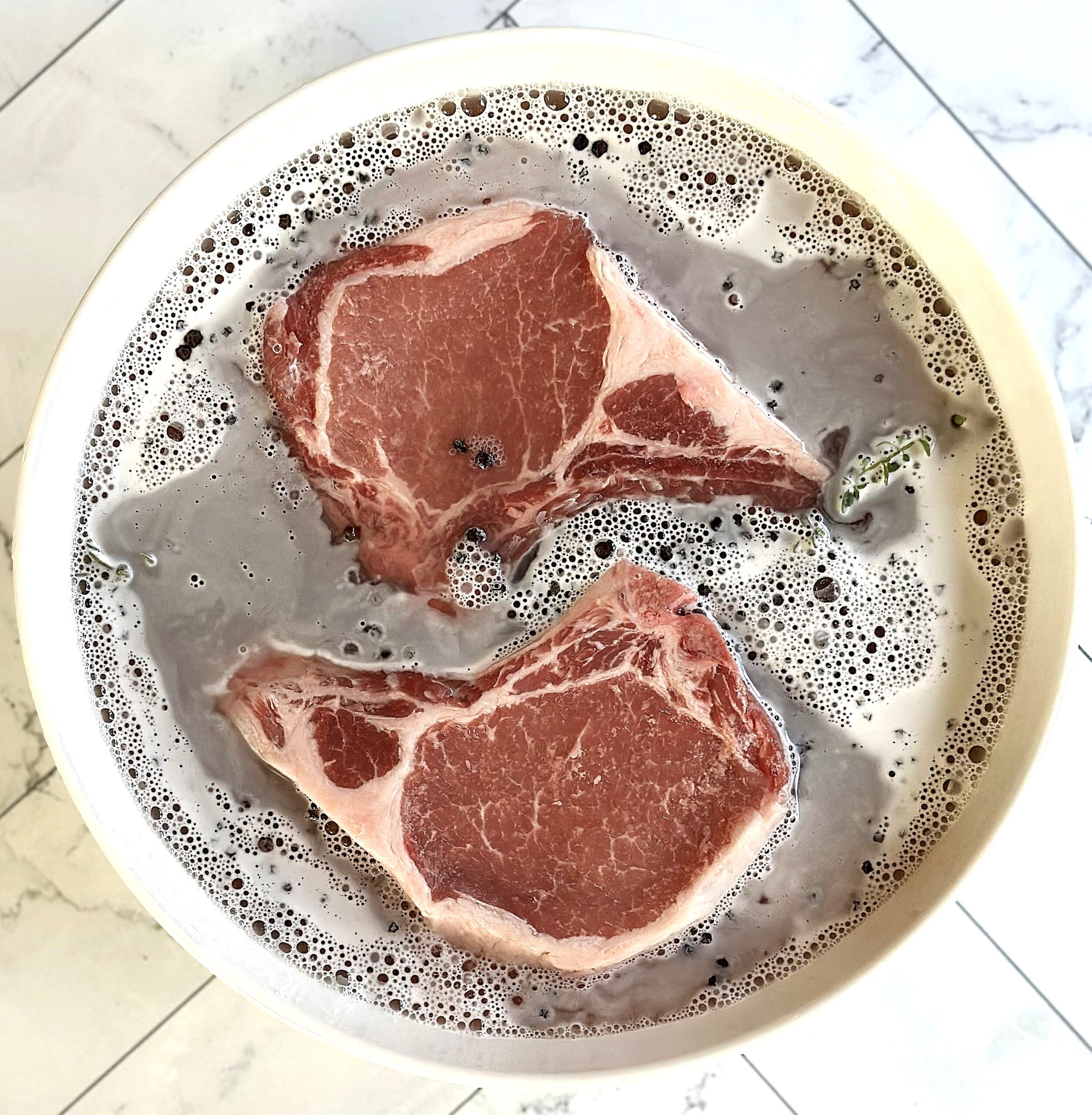 2 pork chops in a brine