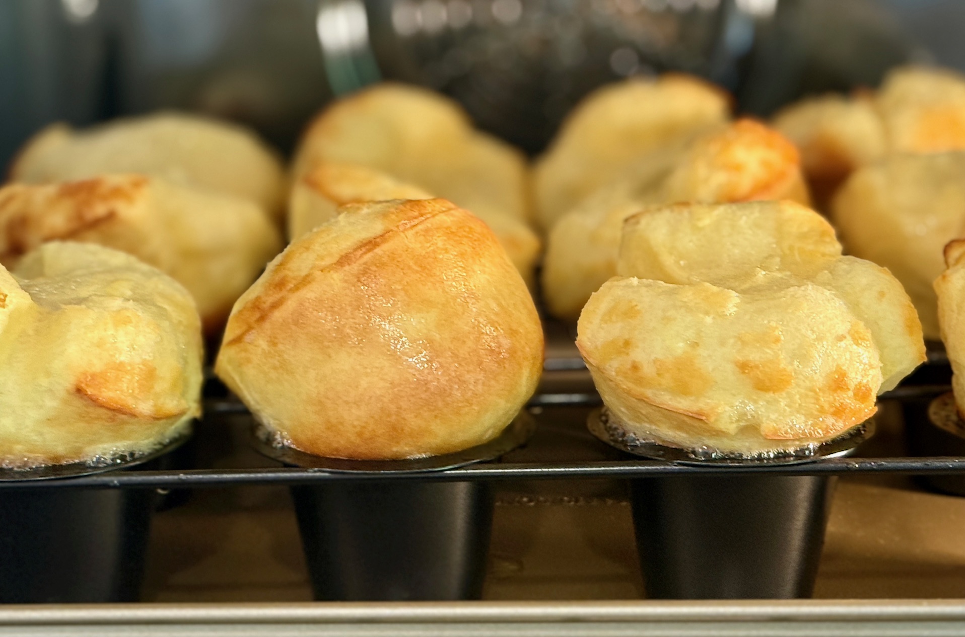 partially baked popovers in a pan