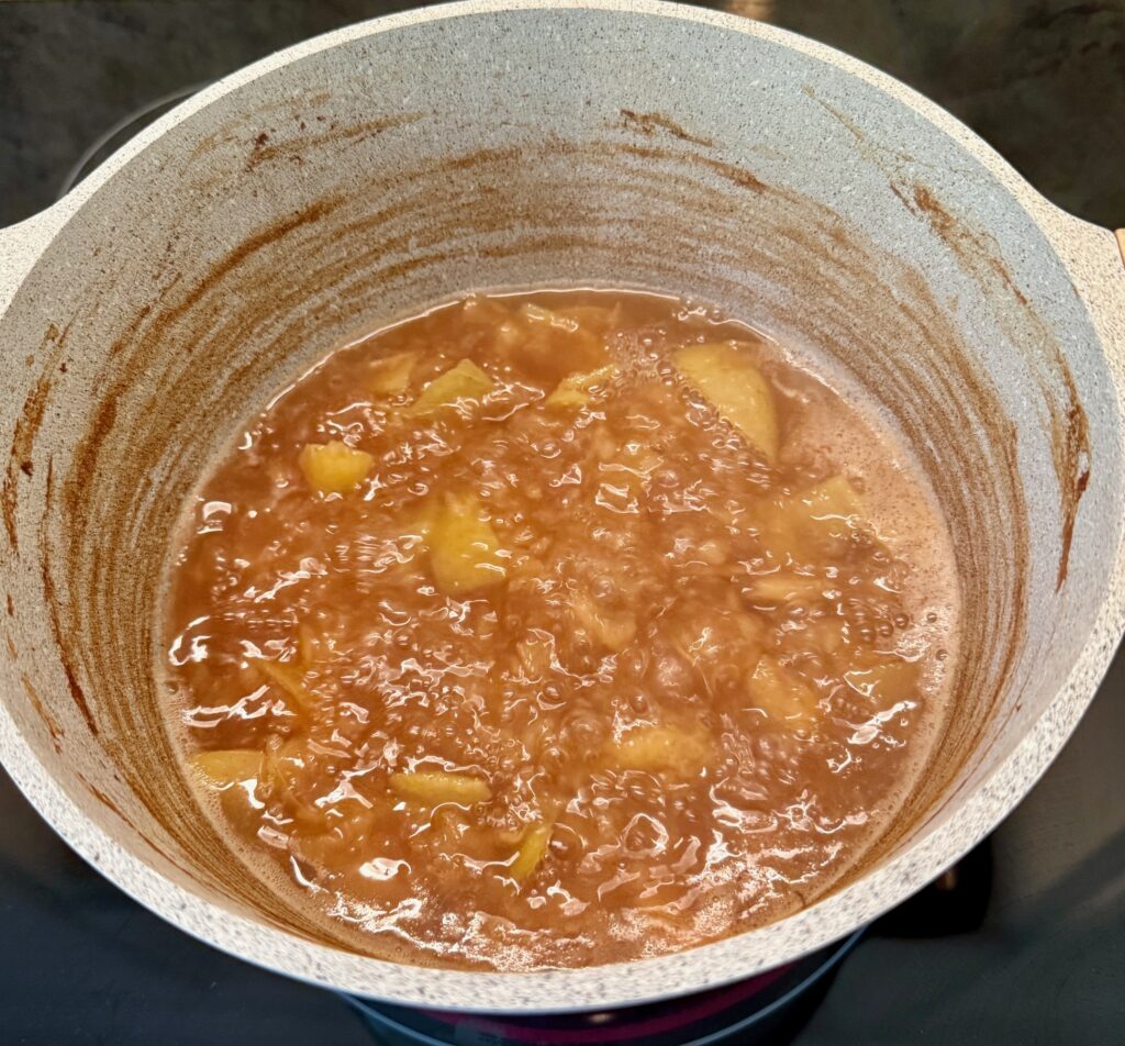 reducing apples for cider in a pot