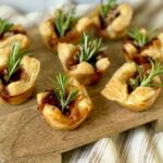 Brie bites on a wood board