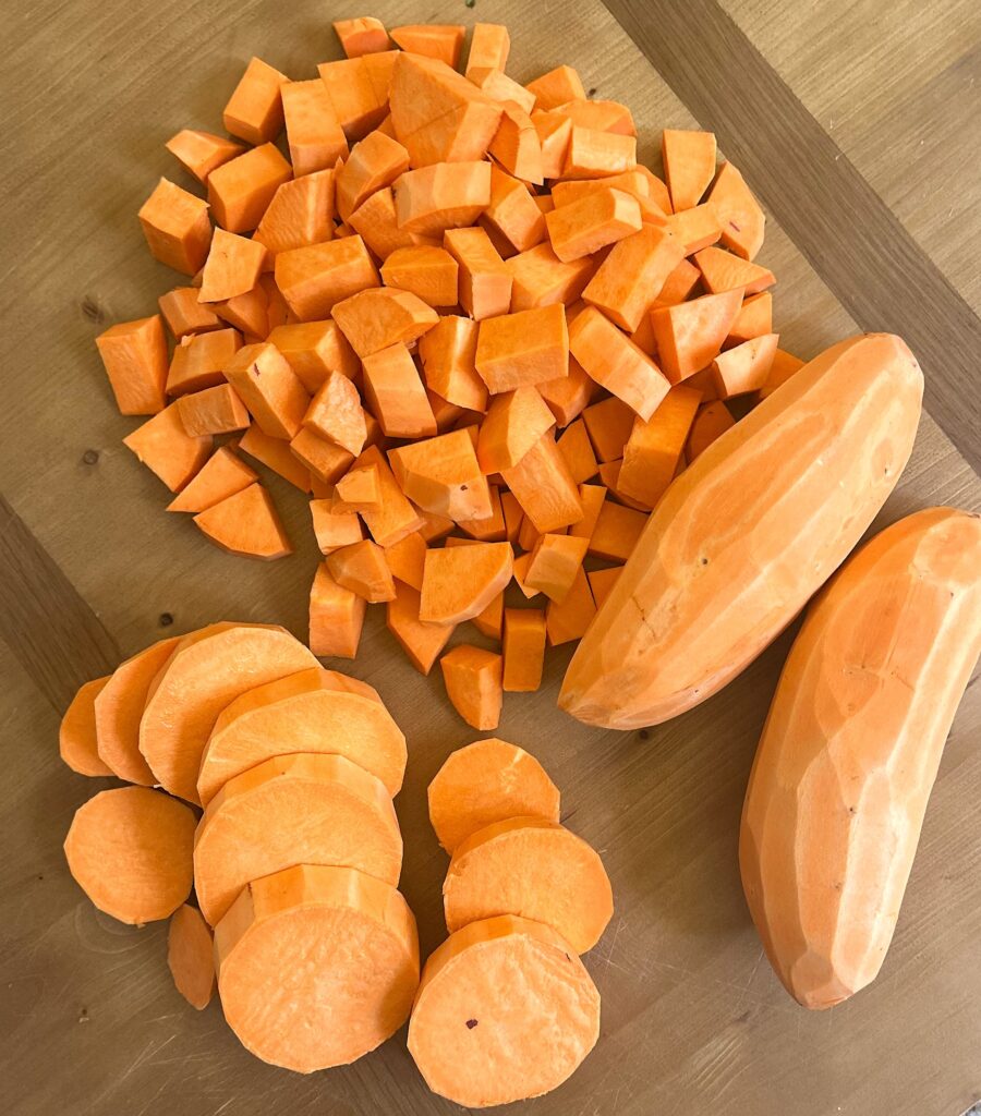 Cutting sweet potatoes into 1-inch cubes