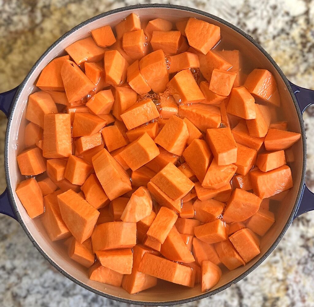 Cubed sweet potatoes covered with water