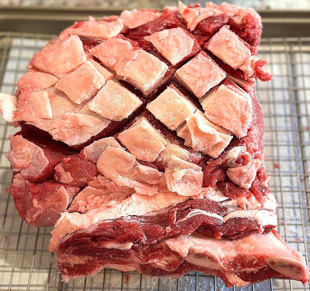 scored meat on a rack