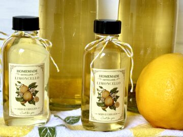 lemoncello in bottles with lemon
