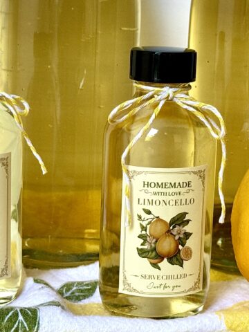 lemoncello in bottles with lemon