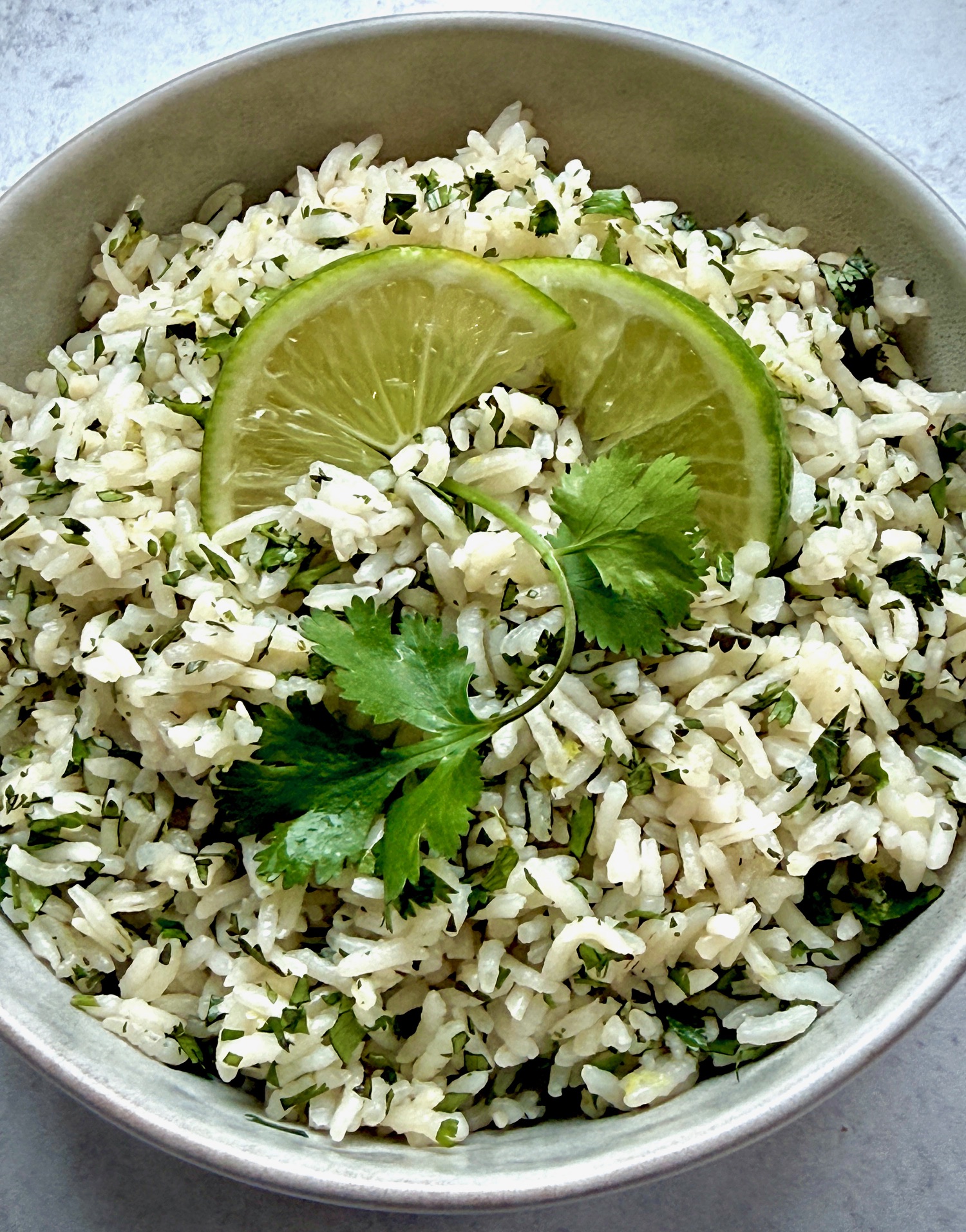 lime rice in a bowl with cilantro