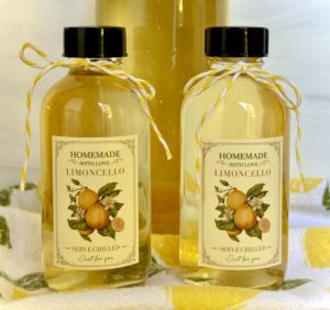 2 limoncello bottles with labels and ribbon