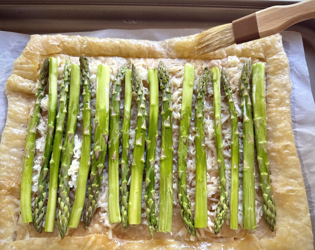 brushing oil on tart shell