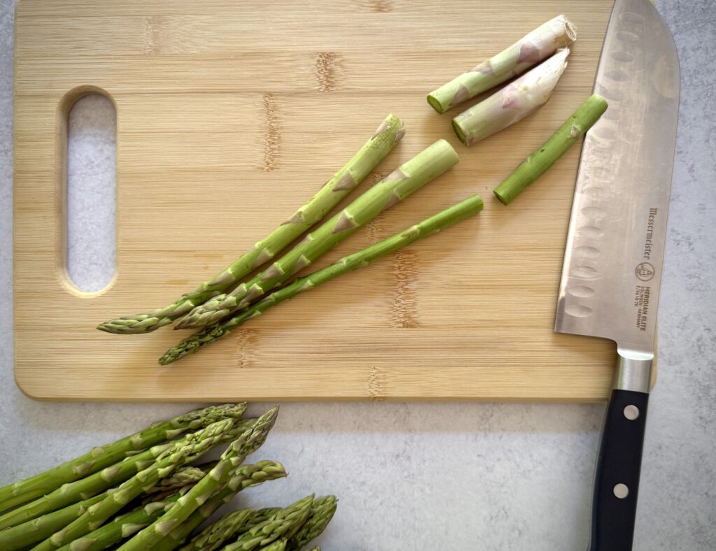 trimming asparagus with a knife
